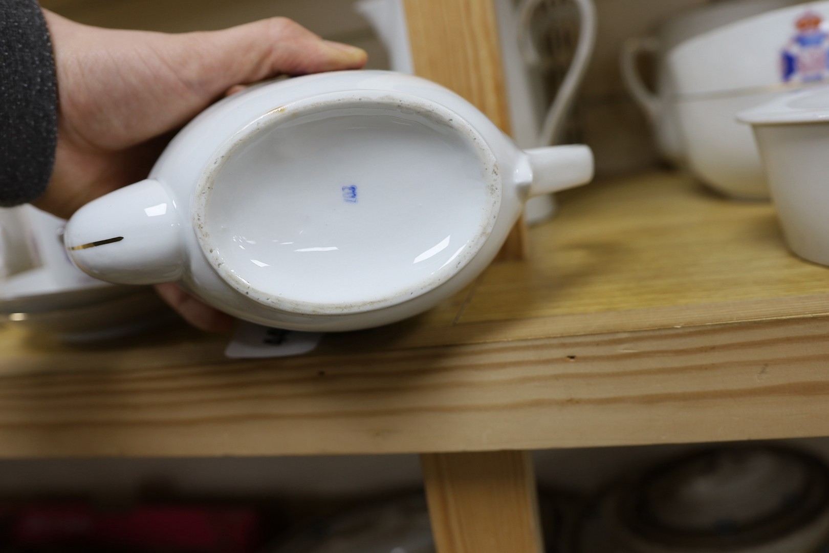 Society of Miniature Rifle Clubs - A large group of commemorative porcelain tea wares, three handled tygs and plates awarded for skill in rifle shooting, early 20th century